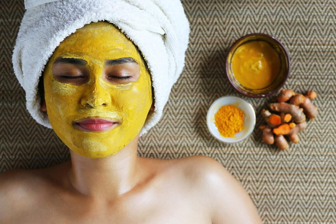 Woman enjoying the skin benefits of a turmeric face mask. Image courtesy of LivingFoodz.com